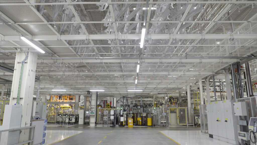Automobile parts conveyor on second level